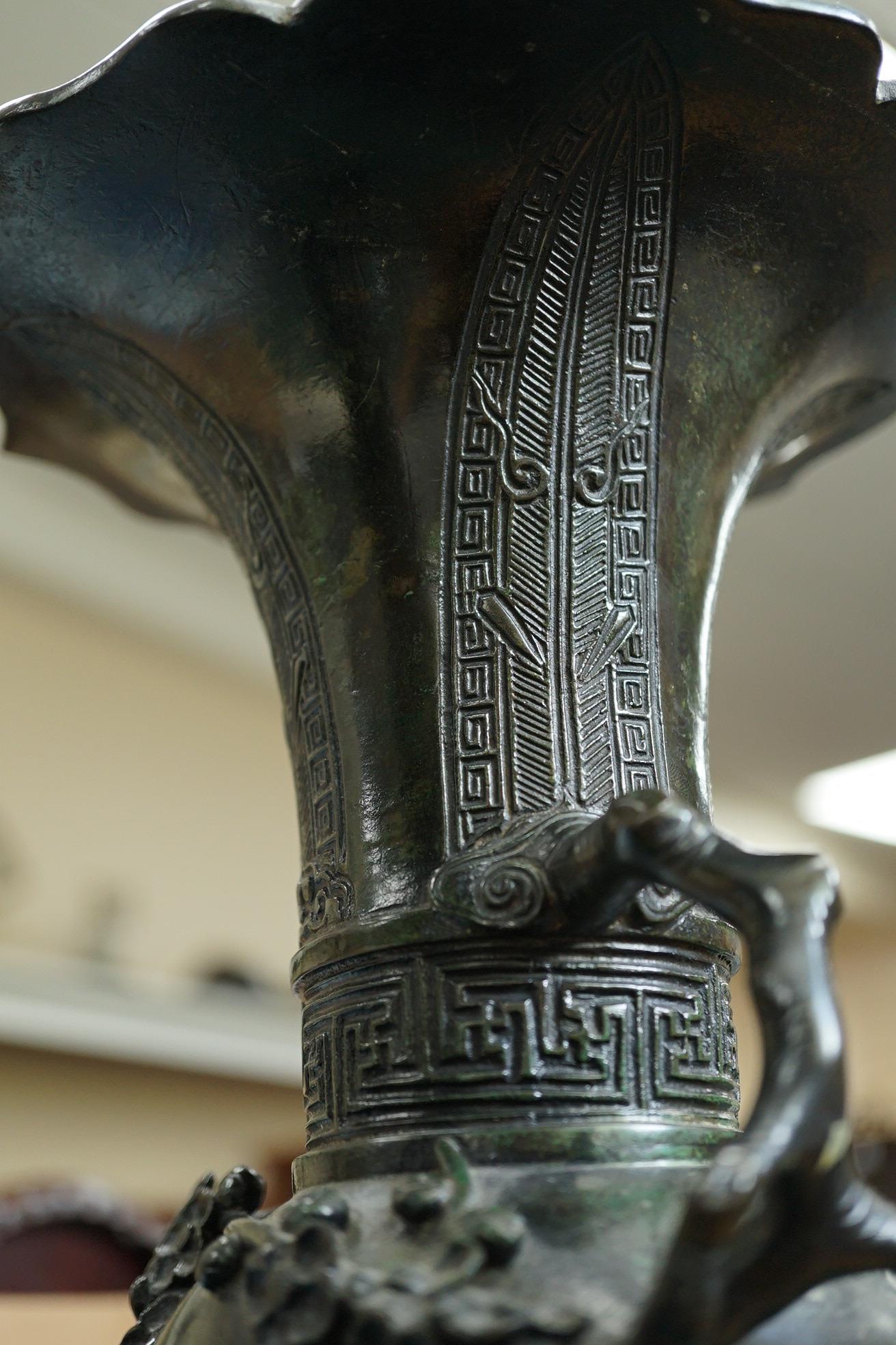 A pair of Chinese bronze gu-shaped vases, Qing dynasty